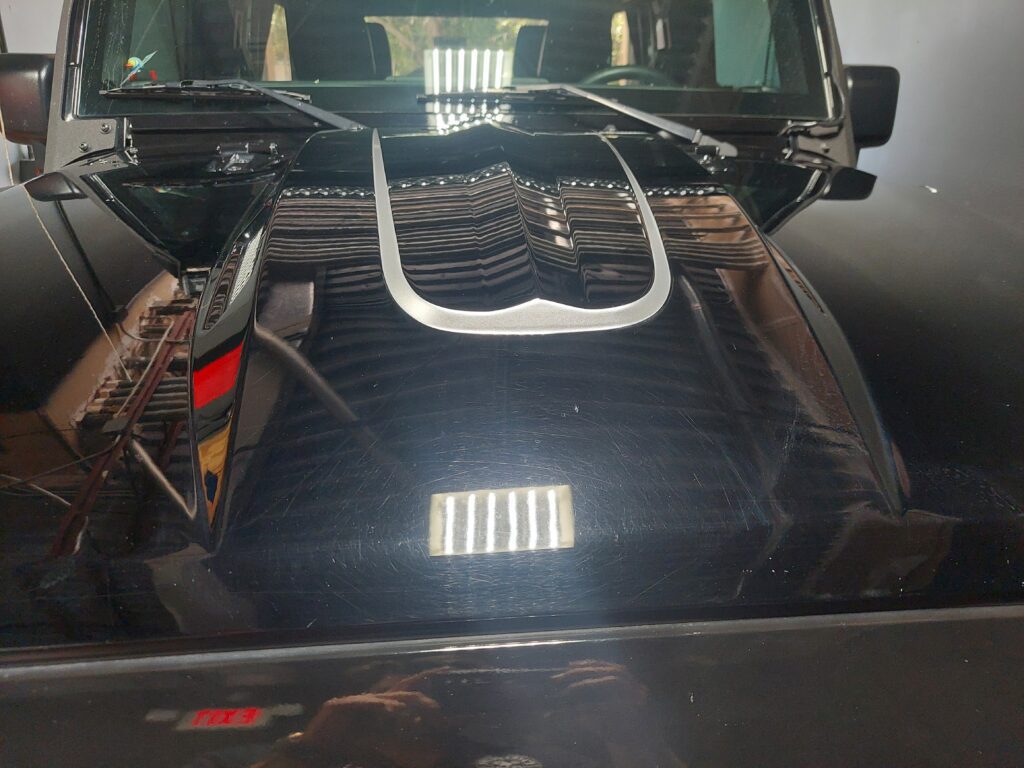 Jeep before paint correction with swirls