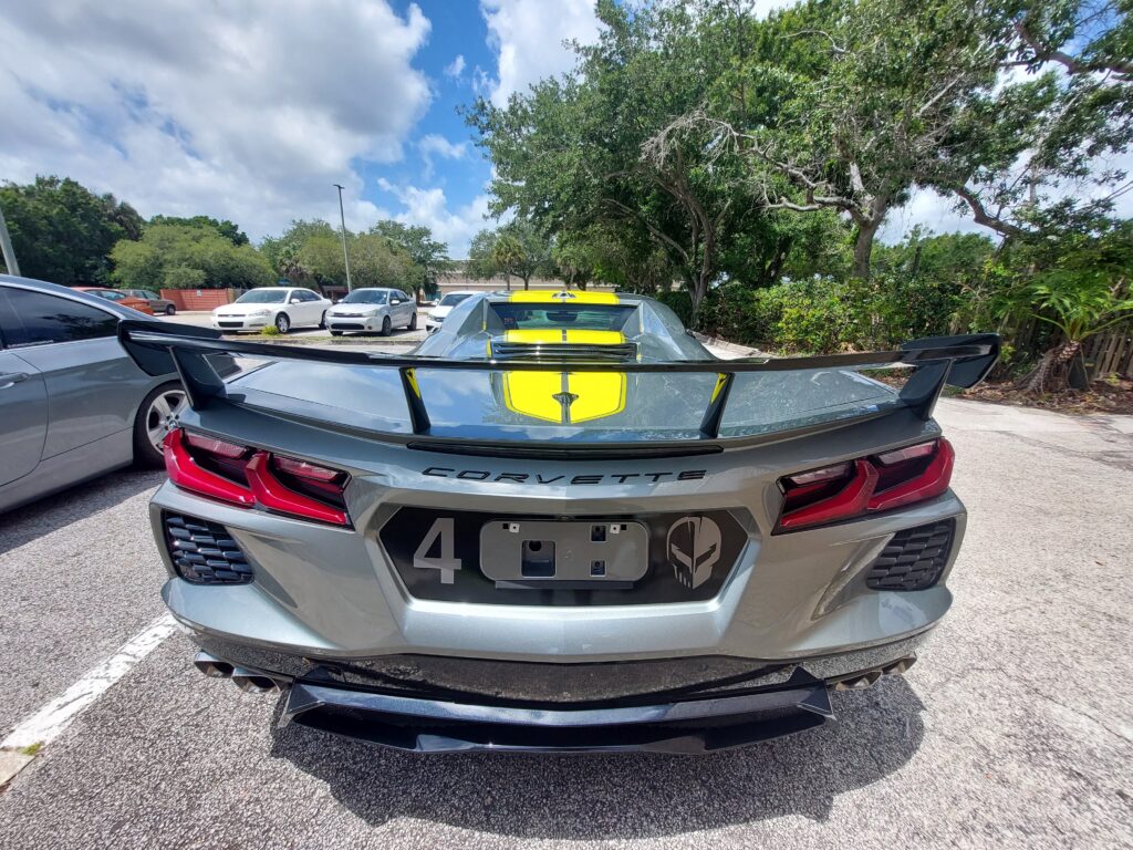 Rear end of a Corvette C8-R Edition before paint correction and ceramic coating