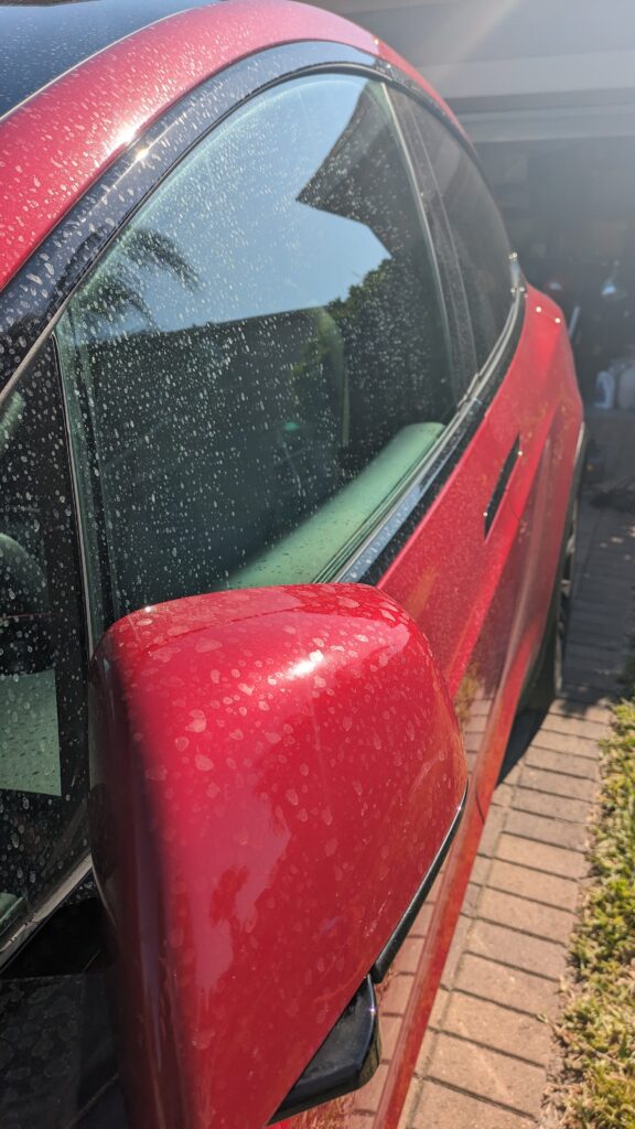 Water spots on Tesla before paint correction in Orlando, FL
